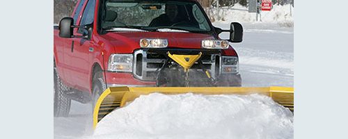 red truck with yellow plow