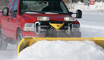 red truck with yellow plow